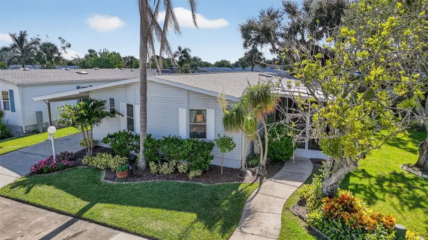 Beautiful home on nicely landscaped lot, tranquil lake and preserve to the right providing views and privacy
