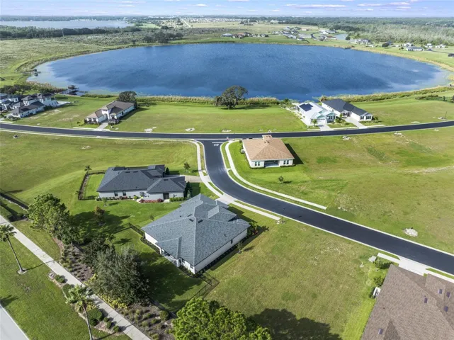 This 2023 BUILT single story **4 bedroom // 3 full bath // 2 offices + theater room** showstopper sits on a large .27 ACRE LOT with gorgeous WATER VIEWS and is packed with modern UPGRADES, smart tech, and access to RESORT STYLE AMENITIES!