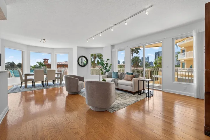 Open and Bright living and dining room. Views of the city skyline.