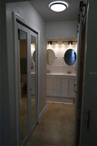 Walk-In Closet to Primary Bathroom