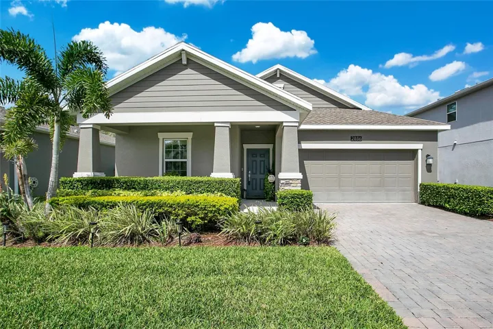 Beautifully landscaped home with front porch.