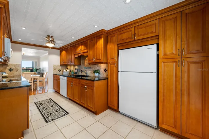 Kitchen with plenty of pantry closets.  Refrigerator