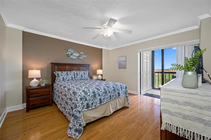 Primary Bedroom with view of Tampa Bay direct in the morning as you awake.  Lanai access via bedroom sliding doors