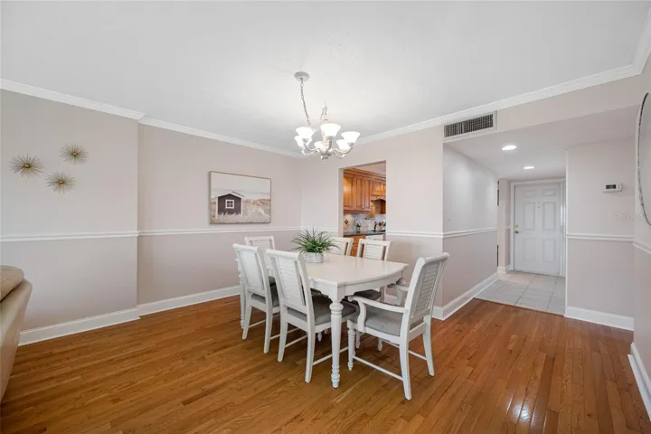 Hardwood flooring throughout dining, living, and bedrooms