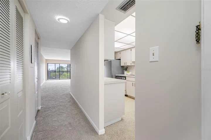 Foyer entry with kitchen located to the right