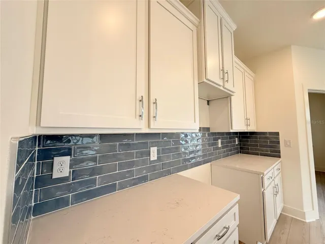 42-inch soft close luxury cabinets, with tile backsplash