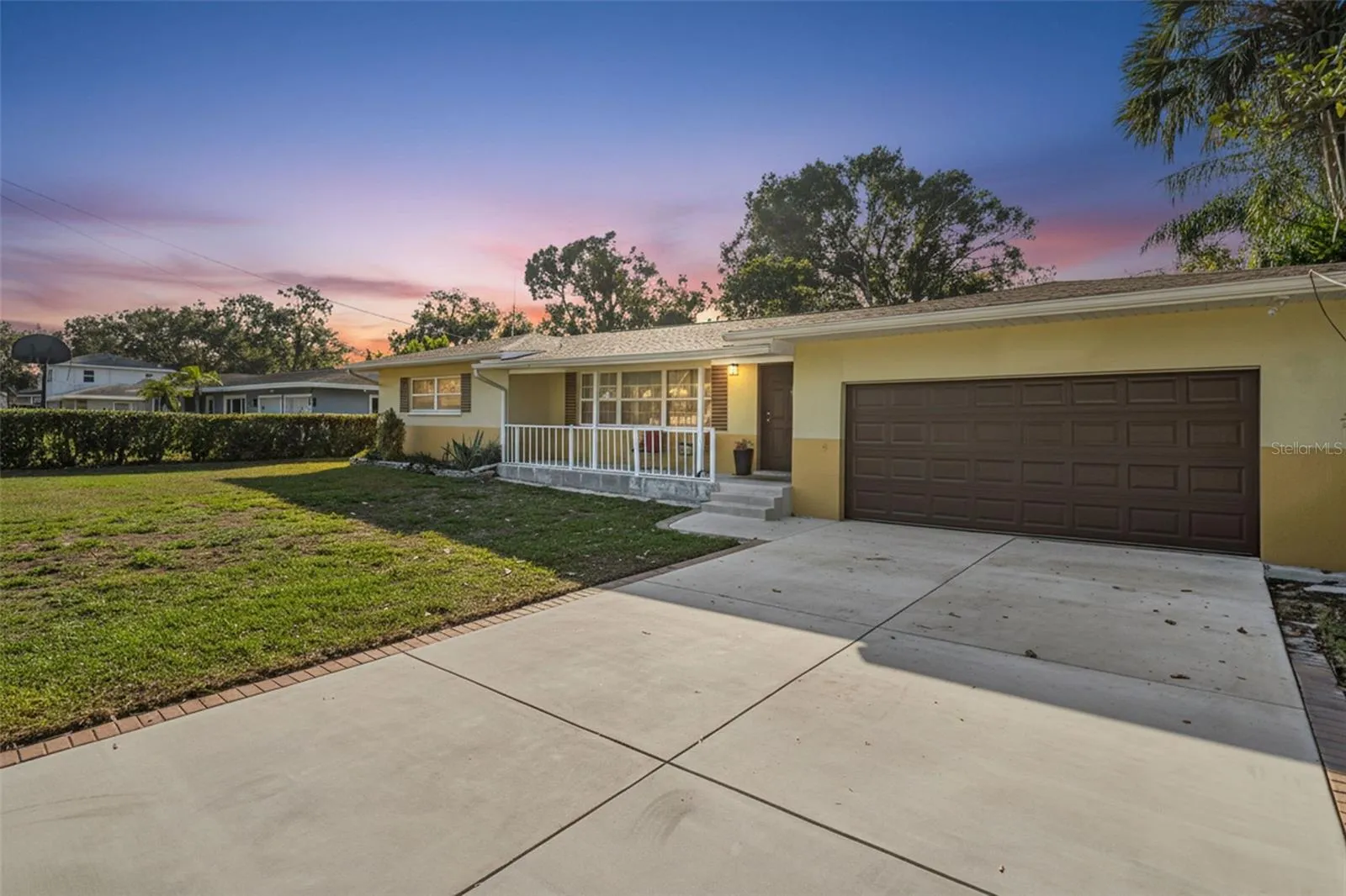 Front View with new garage door, porch and new driveway