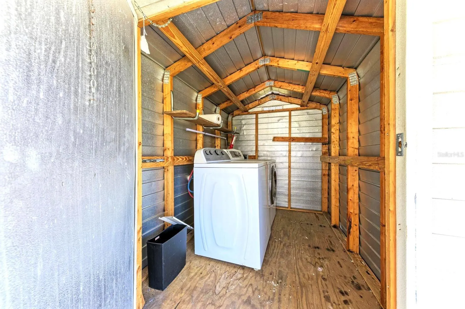 Inside the shed. washer and dryer+ storage