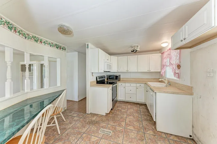 Kitchen with handy writing area on the left