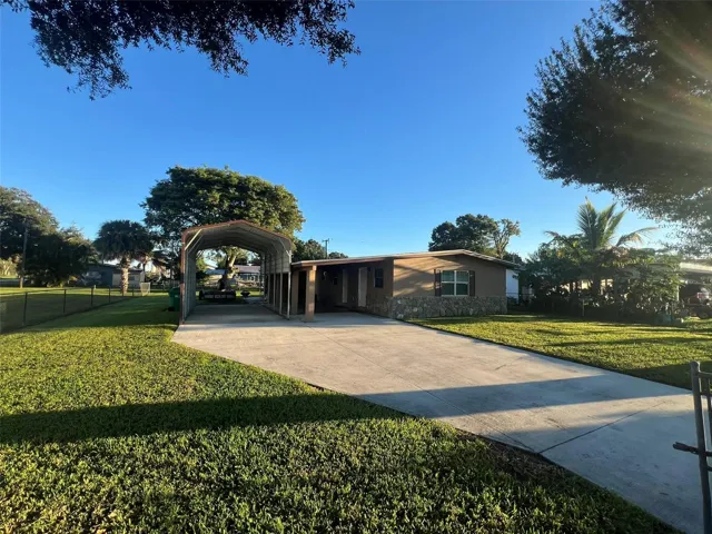 Front with concrete paved driveway