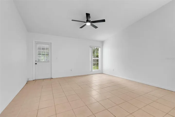 Great room leads to covered back porch