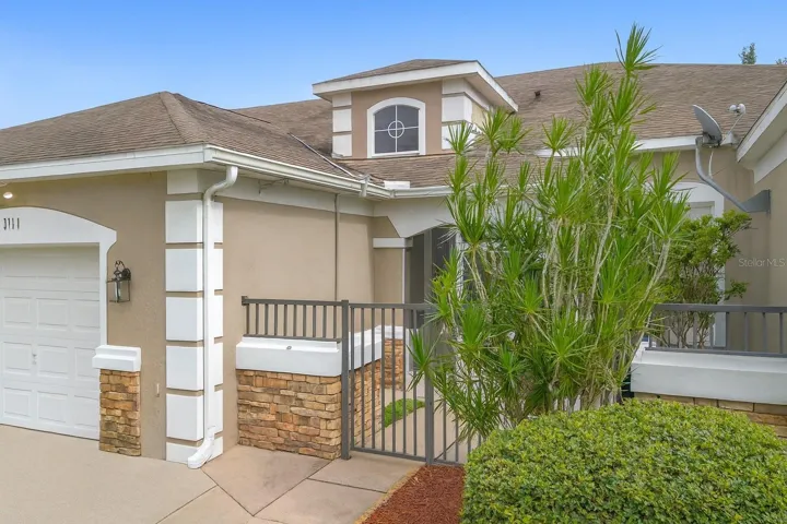 FRONT ELEVATION LEADING TO PRIVATE GATED COURTYARD.
