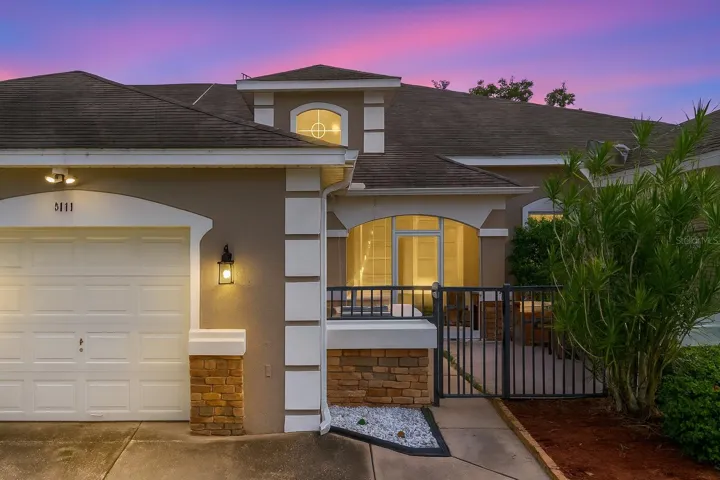 EXTERIOR ENTRANCE AND PRIVATE GARAGE.