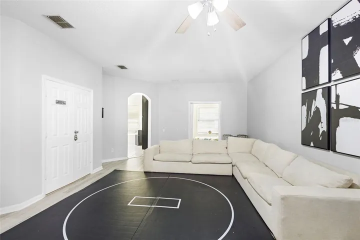 SPACIOUS LIVING ROOM LEADING KITCHEN, FLEX ROOM AND DOUBLE DOOR ( CURRENTLY USED AS OFFICE) BUT COULD BE FORMAL DINING.