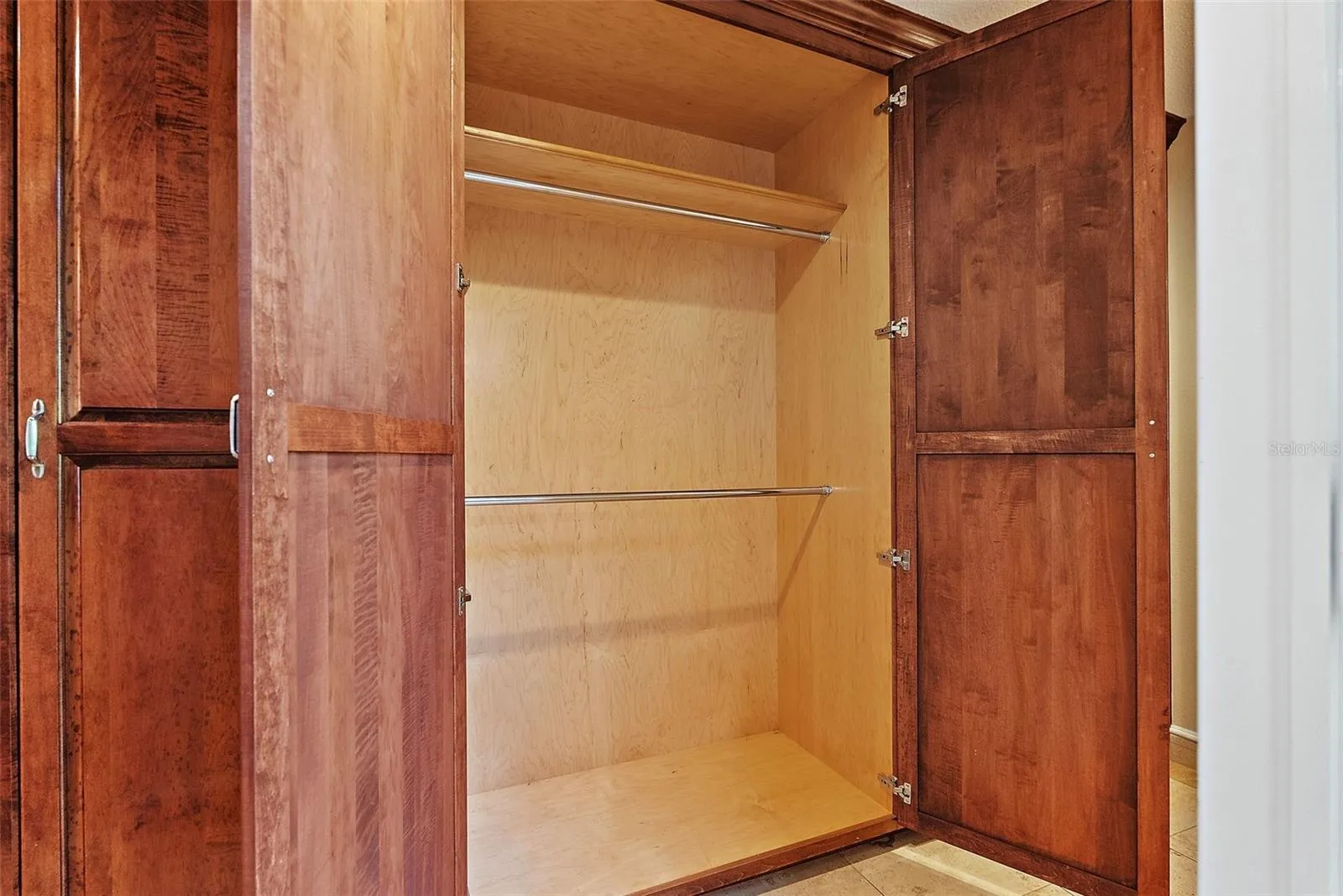 Primary Bedroom walk-in closet w/ built-ins