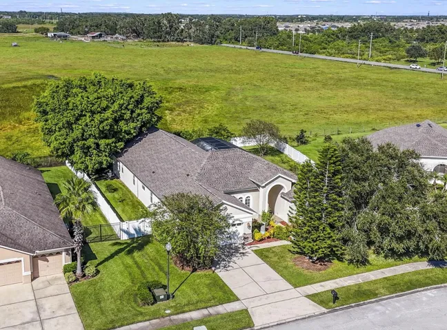 Welcome to idyllic Florida living in Ashley Cove - one of Kissimmee’s most desirable GATED communities, where this single-story 5-bedroom, 3-full bath POOL HOME combines a versatile layout with comfort and privacy!