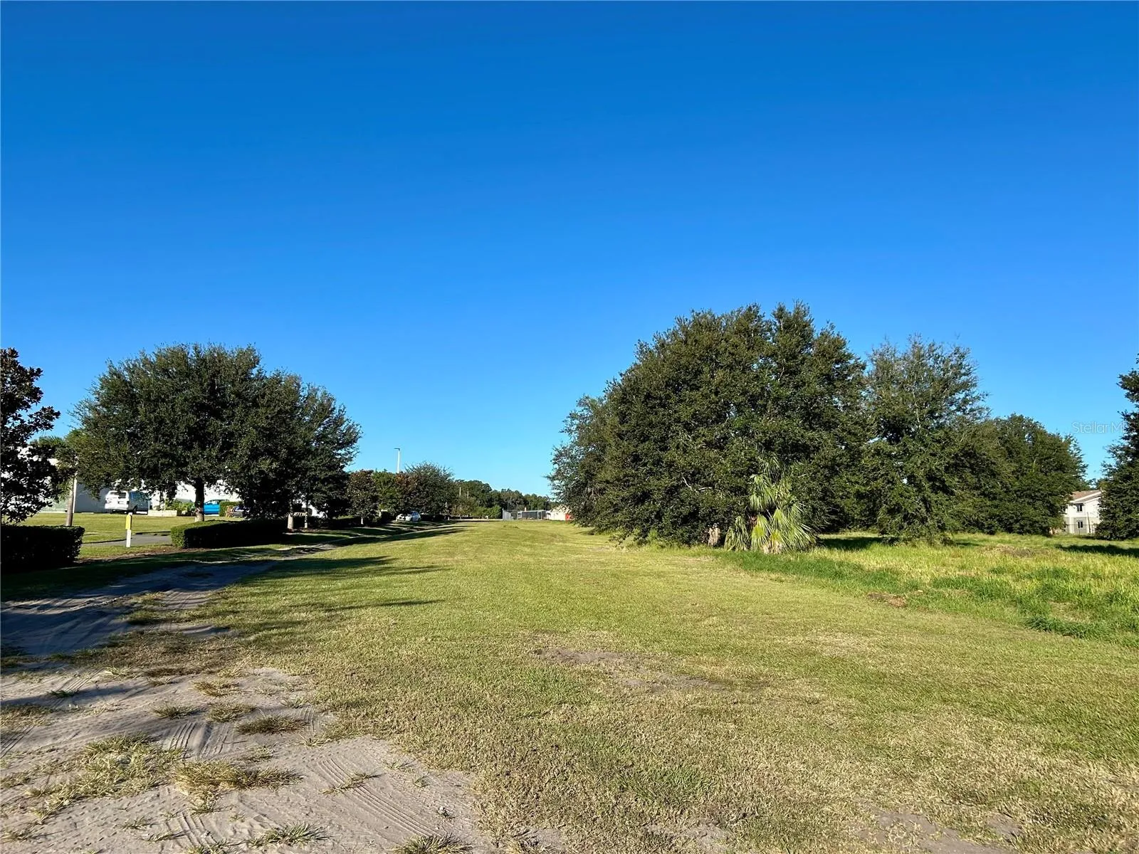 View from 1st Avenue looking west with hospital on the left and apartment complex on the right