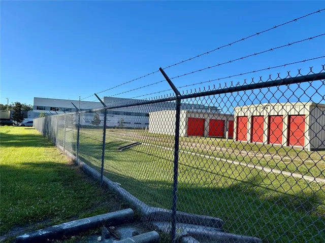 View from property looking southwest toward storage unit buildings and hospital