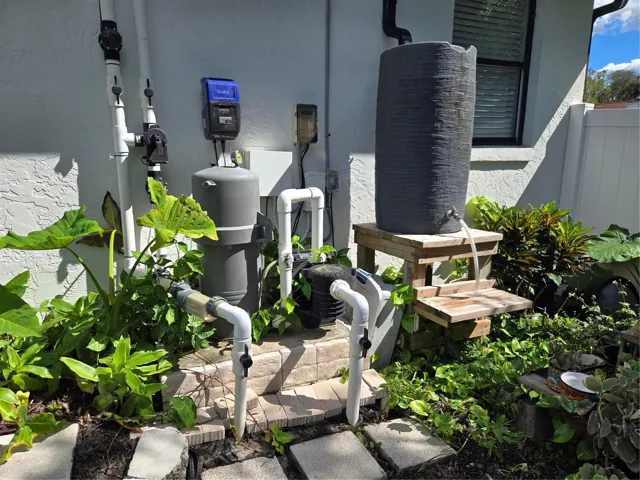 Up Close equipment for pool and Solar, with rain barrel for plants