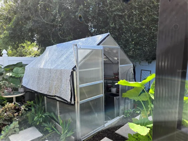 Greenhouse with summer covers to protect plants from too much heat!
