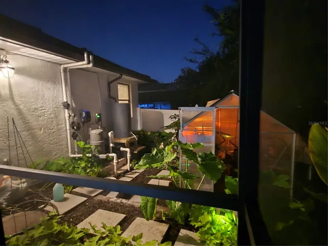 Pool equipment and greenhouse at night