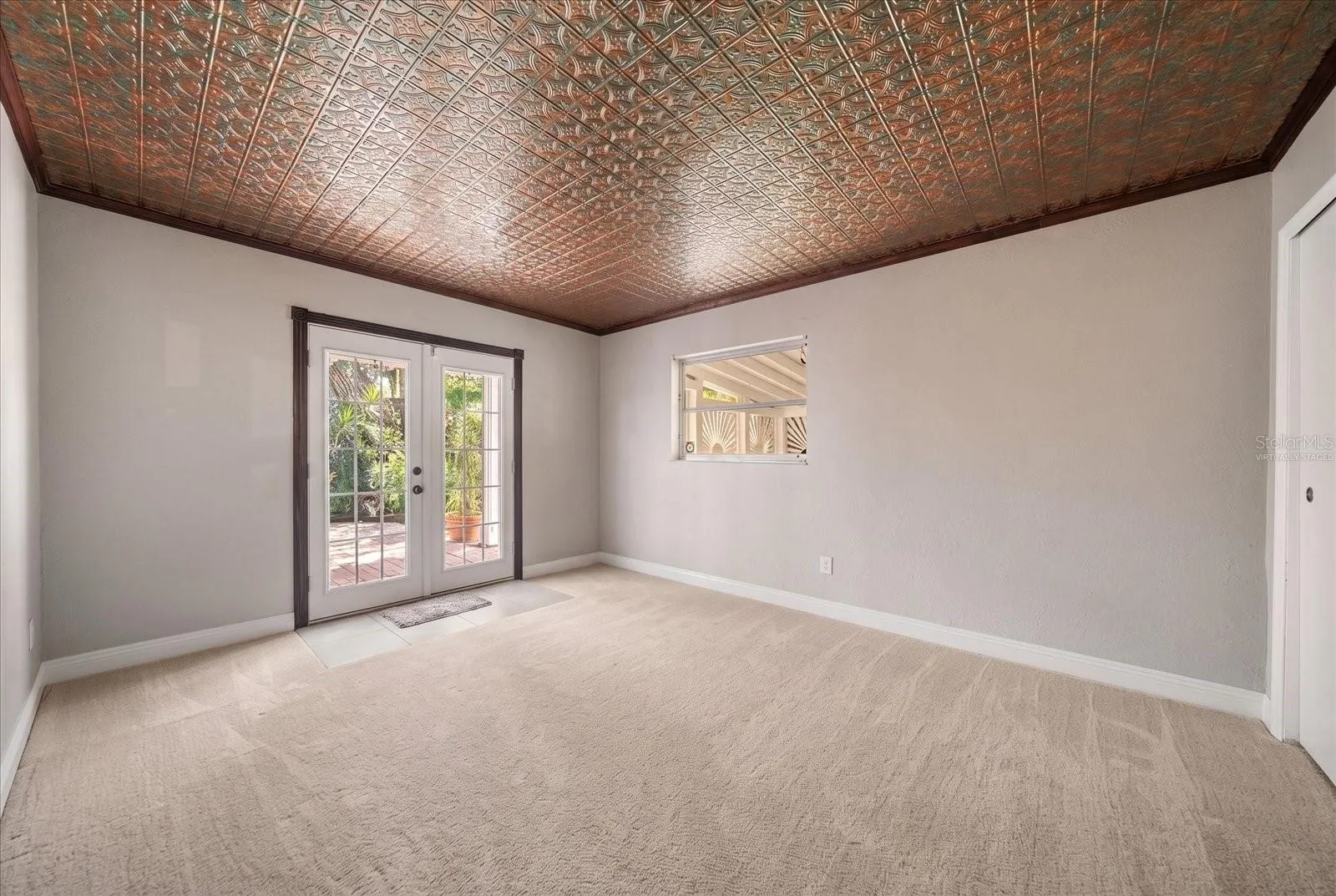 Bedroom - Virtually Staged with Carpet - French Door leading to private fenced yard