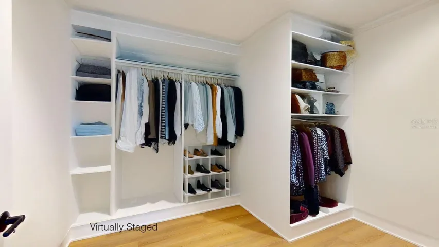 Virtually Staged. Primary Bedroom with Primary Bathroom En-Suite and Walk in Closet