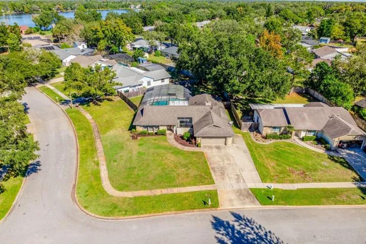 SCREENED POOL & SPA ** LARGE CORNER LOT ** FENCED YARD ** GENERATOR ** SPLIT BEDROOM FLOOR PLAN ** TONS OF UPDATES ** WELCOME HOME!