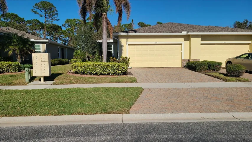 This villa is on the left of the building.  This view shows there is plenty of space between buildings and the community has sidewalks.