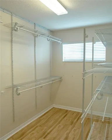 Primary Bedroom walk-in closet