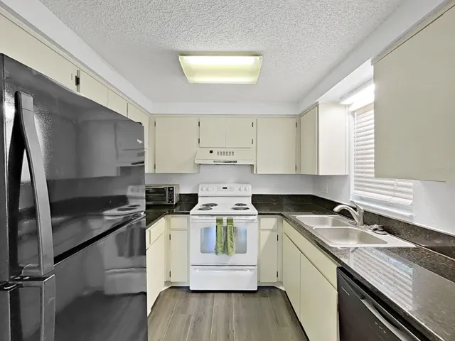 Everything you may need with upper and lower cabinets and granite counters!