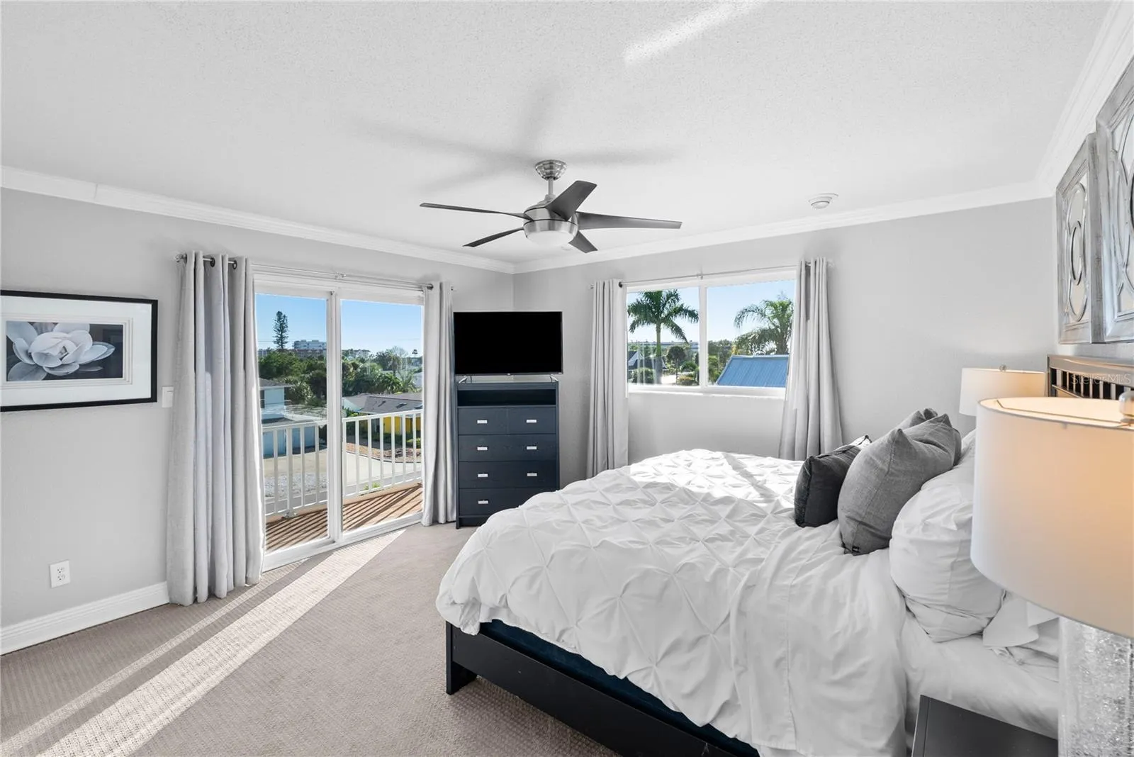Guest room #3 with TV and balcony.