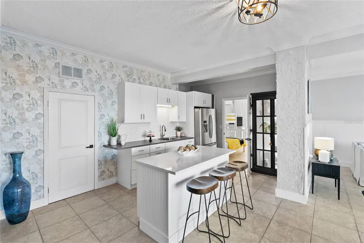 kitchenette — ideal for entertaining or multi-generational living. Quartz countertops.
