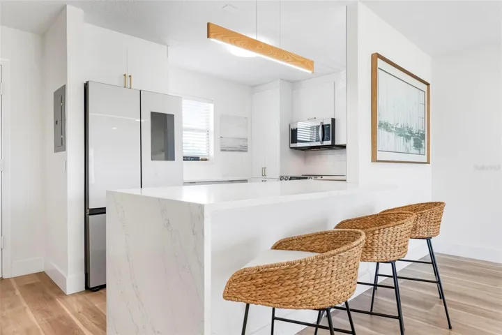Updated Kitchen with smart appliances, stone countertops
