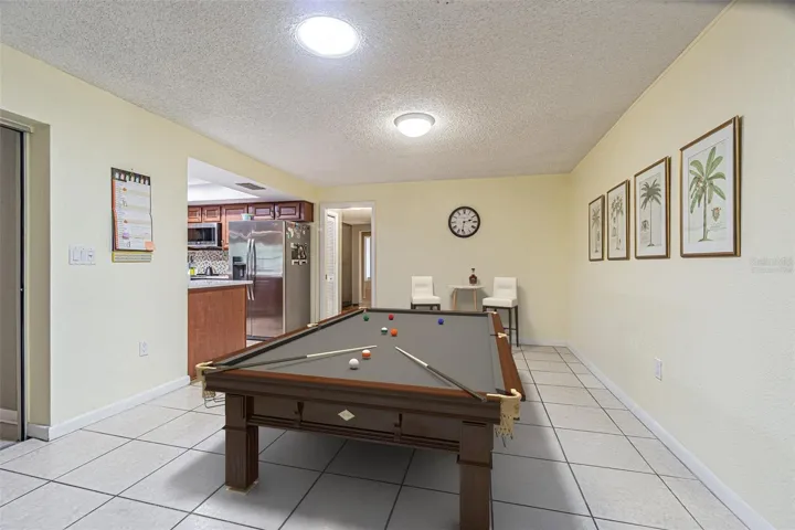Virtually Staged to show that the dining area can be utilized  as a bonus room. This room is off the secondary bedrooms as well.
