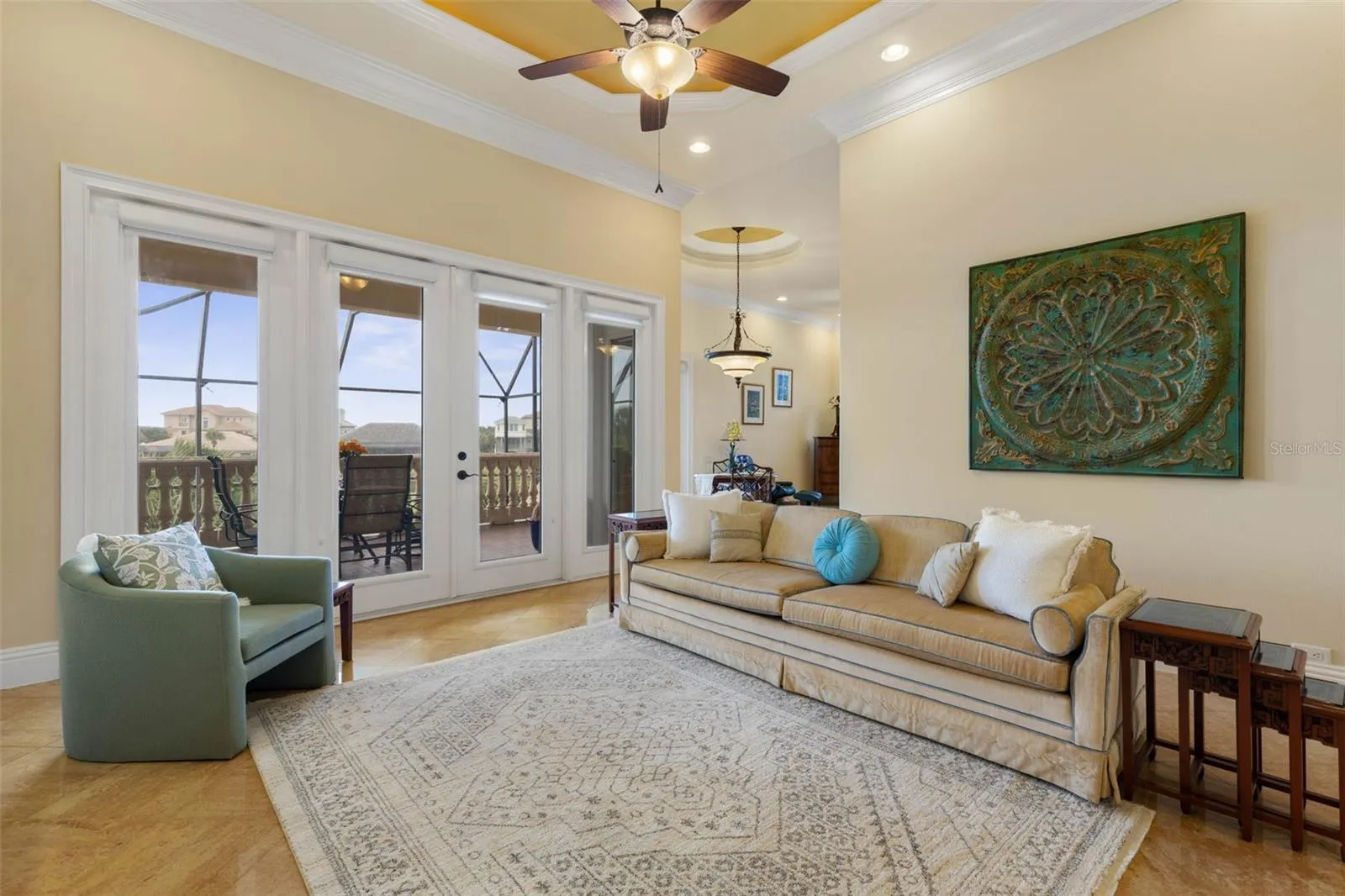 Family room with french doors leading out to outside lanai
