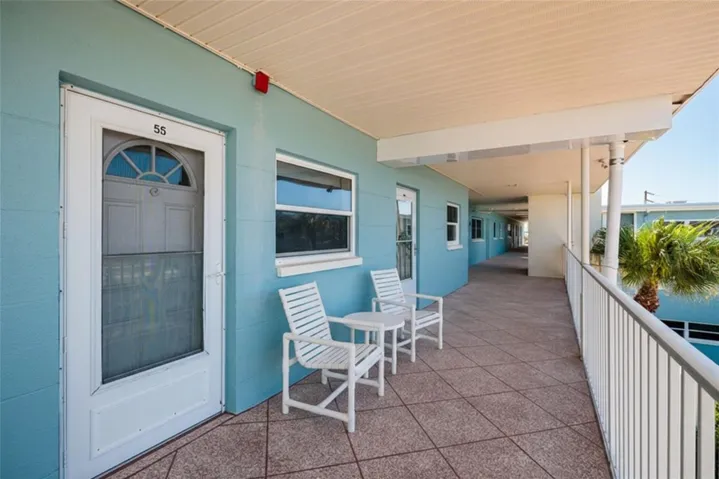 Virtually Staged. Door to 2nd bedroom on left & front door on right. Elevator in front of next unit down walkway.