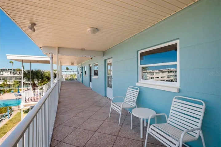 Virtually Staged. Enjoy Sunsets, Ocean breezes & swaying palm trees from your front walkway/porch.
