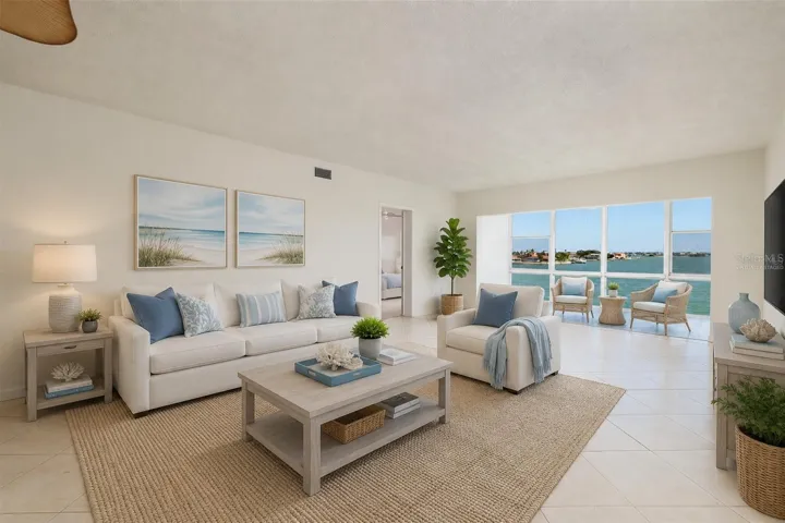 Virtually staged. Living area & Florida room w/Bay views.