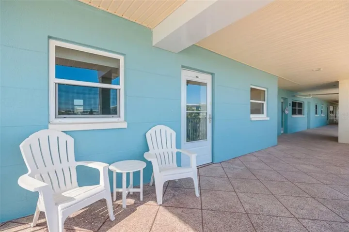Virtually Staged. Relax on your covered front walkway/porch, enjoy the ocean breeze & sunsets.