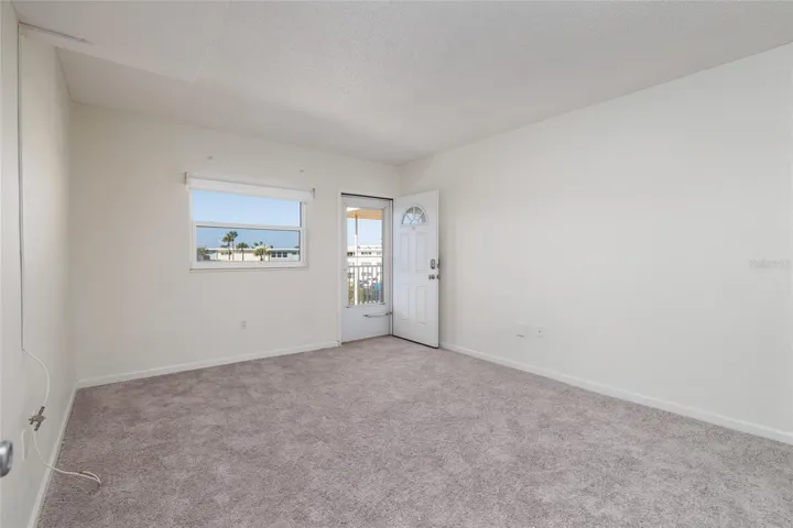 2nd bedroom w/Door to the front covered walkway/porch.