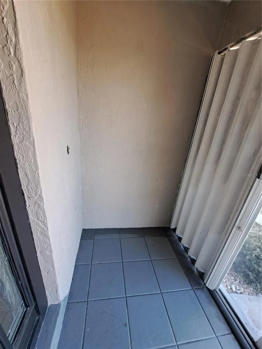 Screen front door porch with hurricane shutters