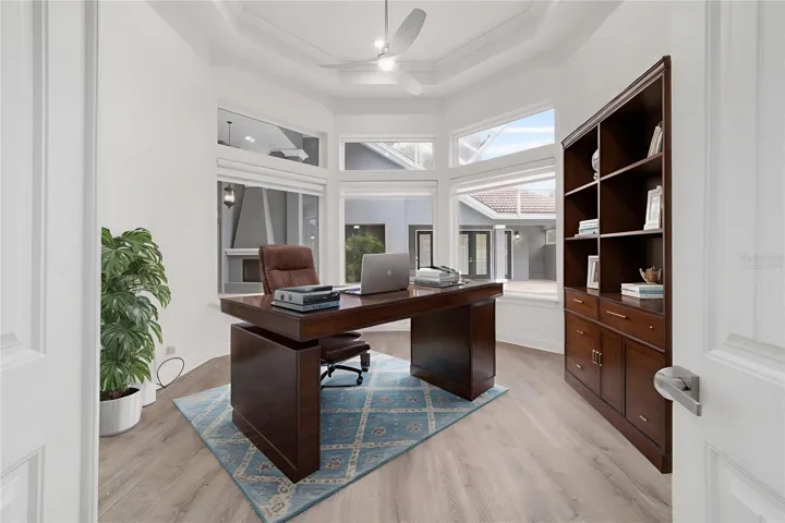 Virtually Staged - Level Office with Picture Windows Overlooking Courtyard and Swimming Pool