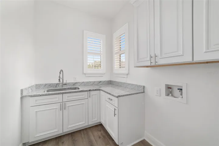 Laundry Room with Cabinets and Stone Countertops - Main Level