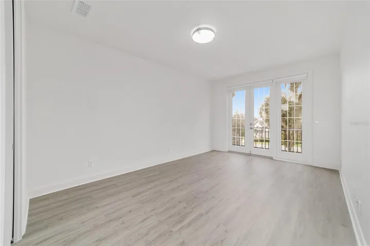 Upper Level Bedroom #4 with Private Balcony & Walk-In Closet
