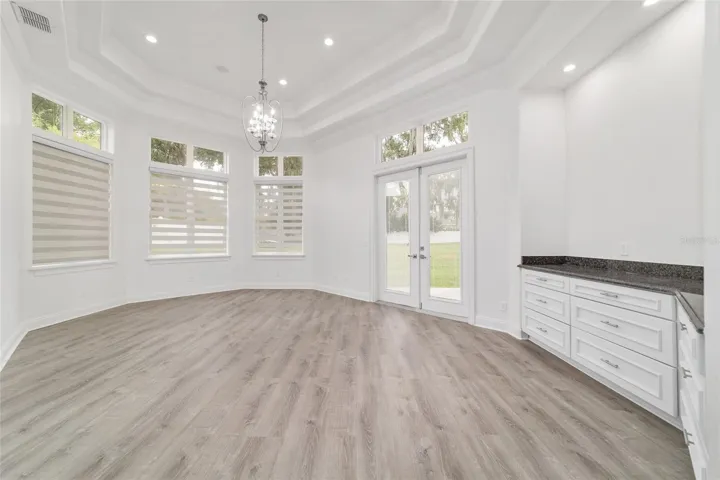 Main Level Primary Bedroom with Built in Cabinets and Stone Cabintet Tops.