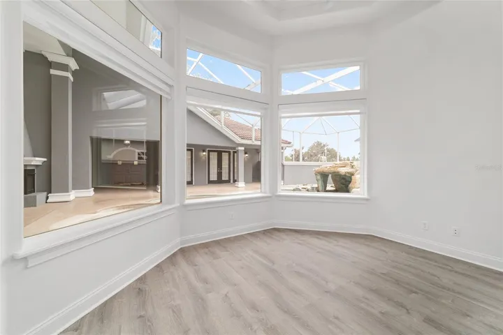 Main Level Office with Picture Windows Overlooking Courtyard and Swimming Pool