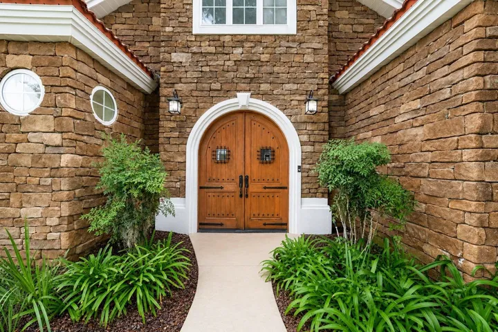 Gorgeous Double Wood Door Entry to Courtyard