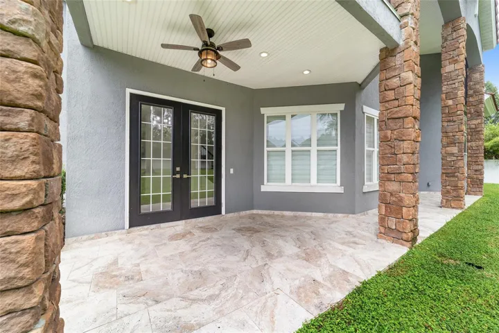 Rear Patio with Access from Dining Room and Main Level Primary Bedroom