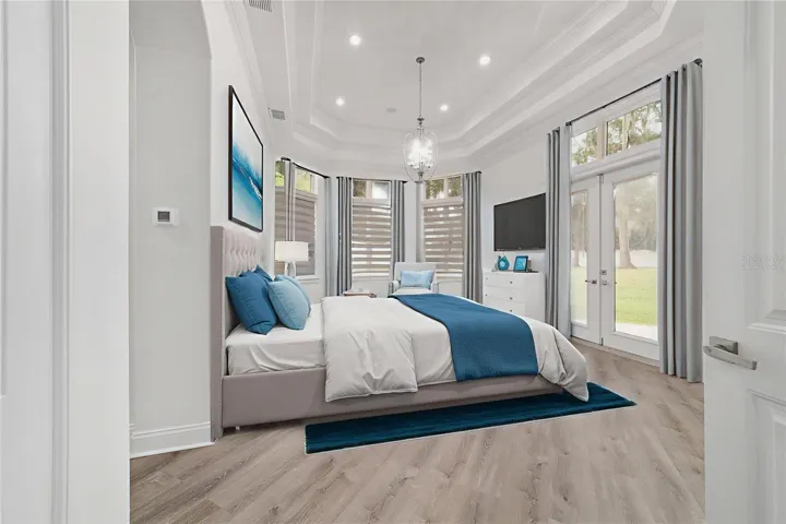 Virtually Staged Main Level Primary Bedroom, Tray Ceiling with Access to Patio